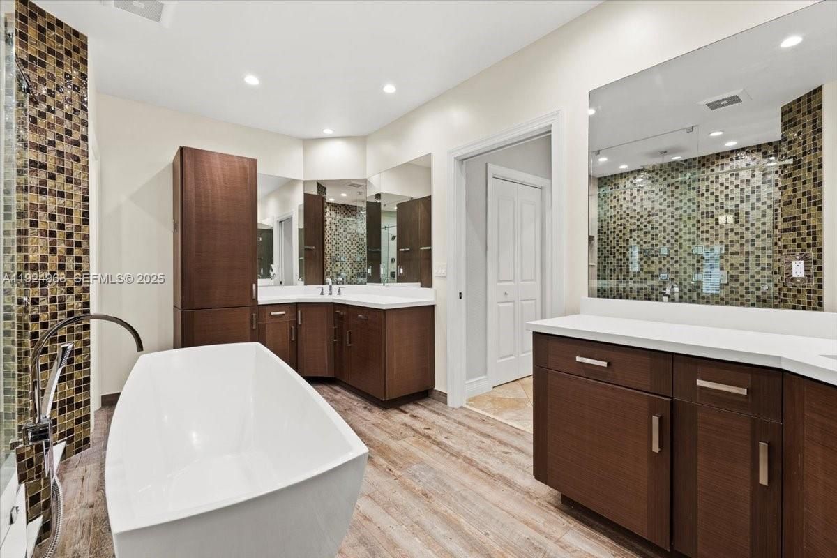 Bathroom, Dual Sink Vanities, Free Standing Baths, Glass Shower, Interior, Recessed Lighting, Wood Texture Flooring