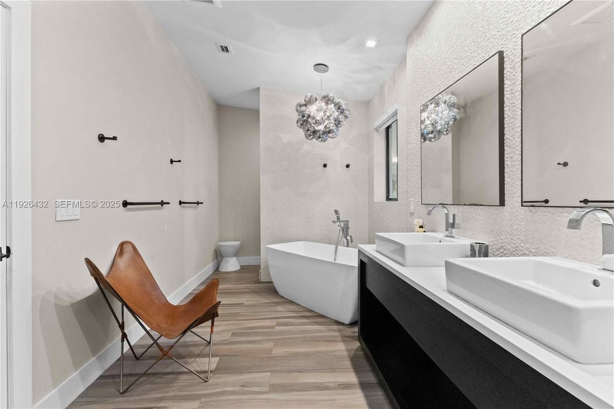 Bathroom, Chandelier, Dual Sink Vanities, Free Standing Baths, Interior, Pendant Lights, Recessed Lighting, Wood Texture Flooring
