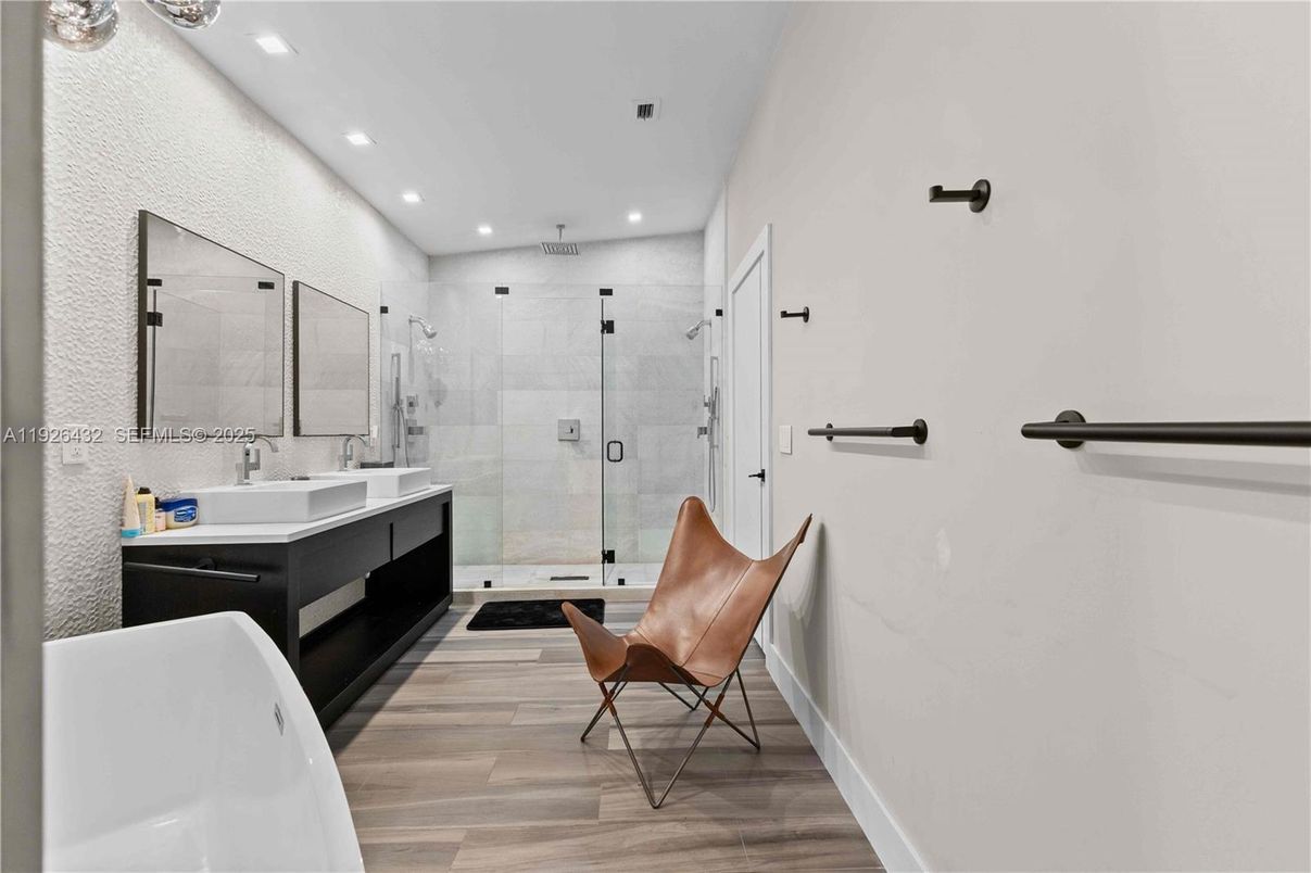 Bathroom, Dual Sink Vanities, Free Standing Baths, Glass Shower, Interior, Recessed Lighting, Wood Texture Flooring