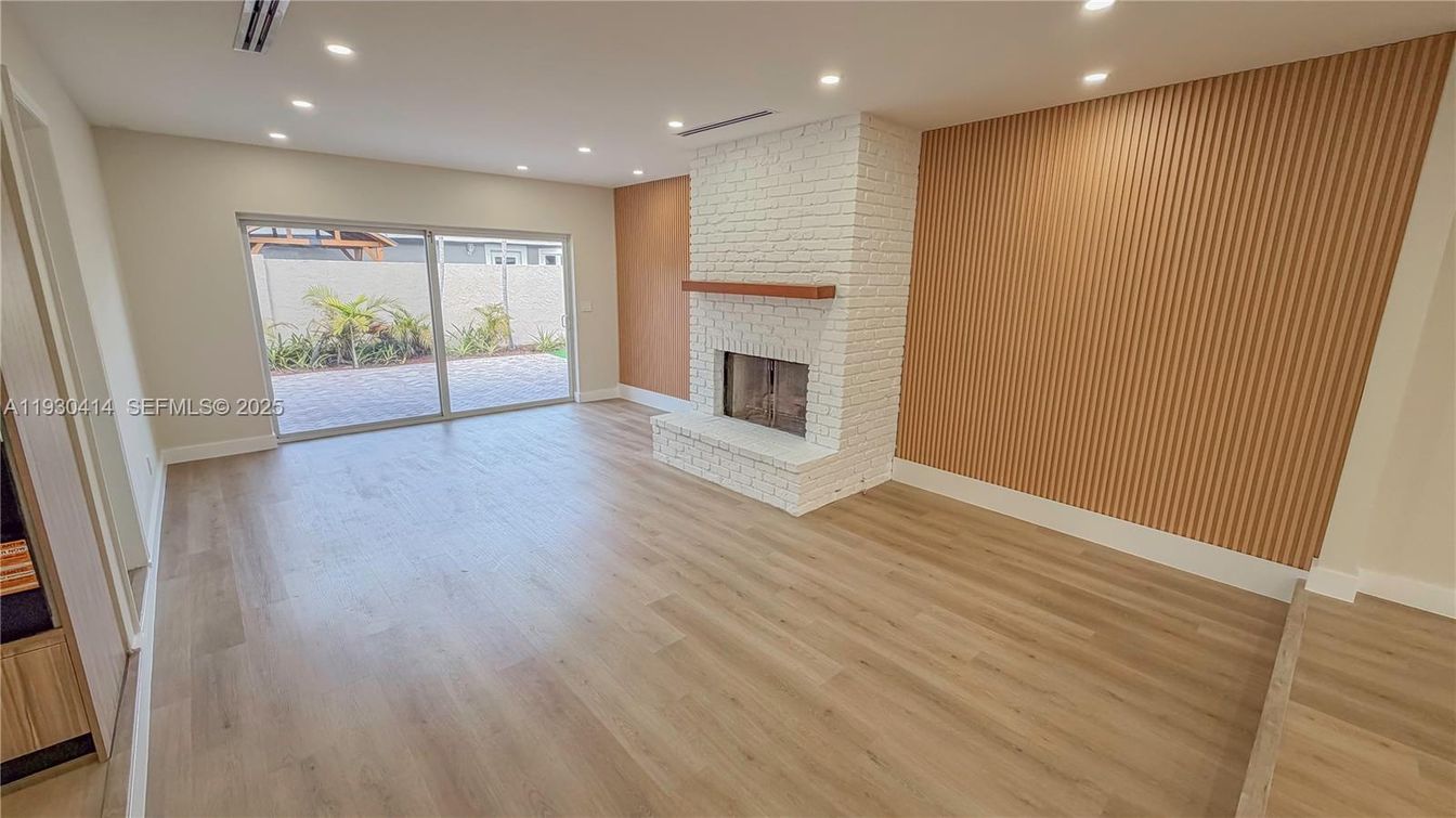 Empty room, Fireplace, Interior, Recessed Lighting, Stone Walls, Wood Texture Flooring