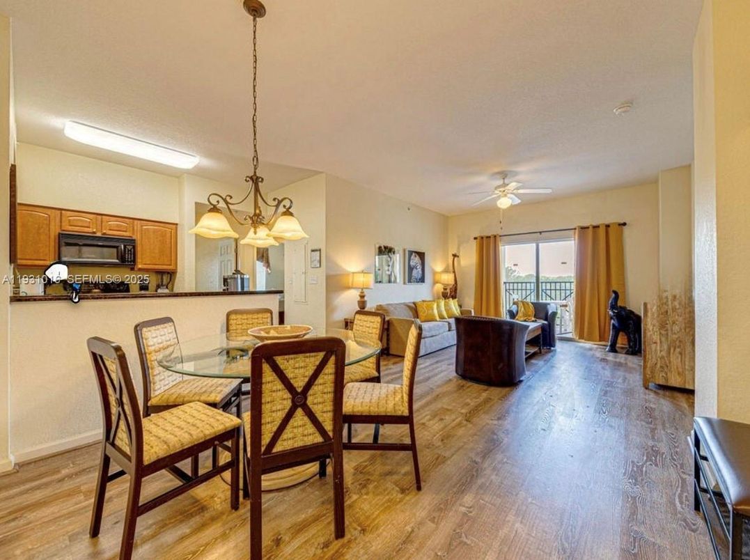 Chandelier, Dining room, Interior, Kitchen, Living room, Pendant Lights, Stainless Steel Appliances, Wood Texture Flooring