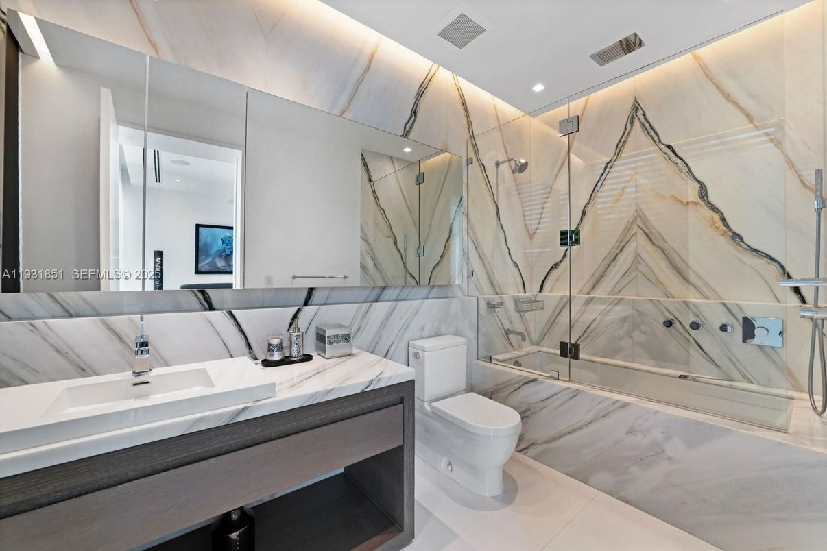 Bathroom, Dual Sink Vanities, Glass Shower, Interior, Marble Walls, Recessed Lighting