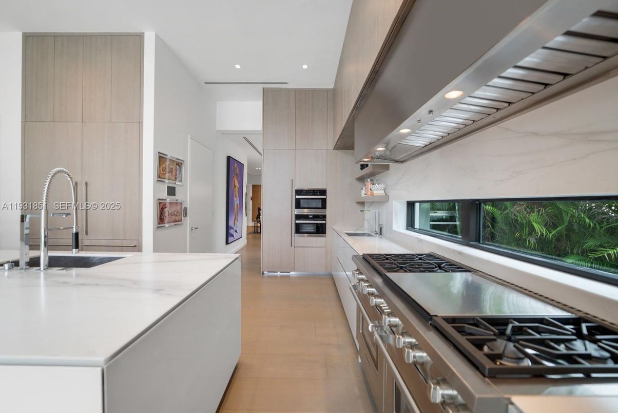 Interior, Kitchen, Marble Walls, Recessed Lighting, Stainless Steel Appliances