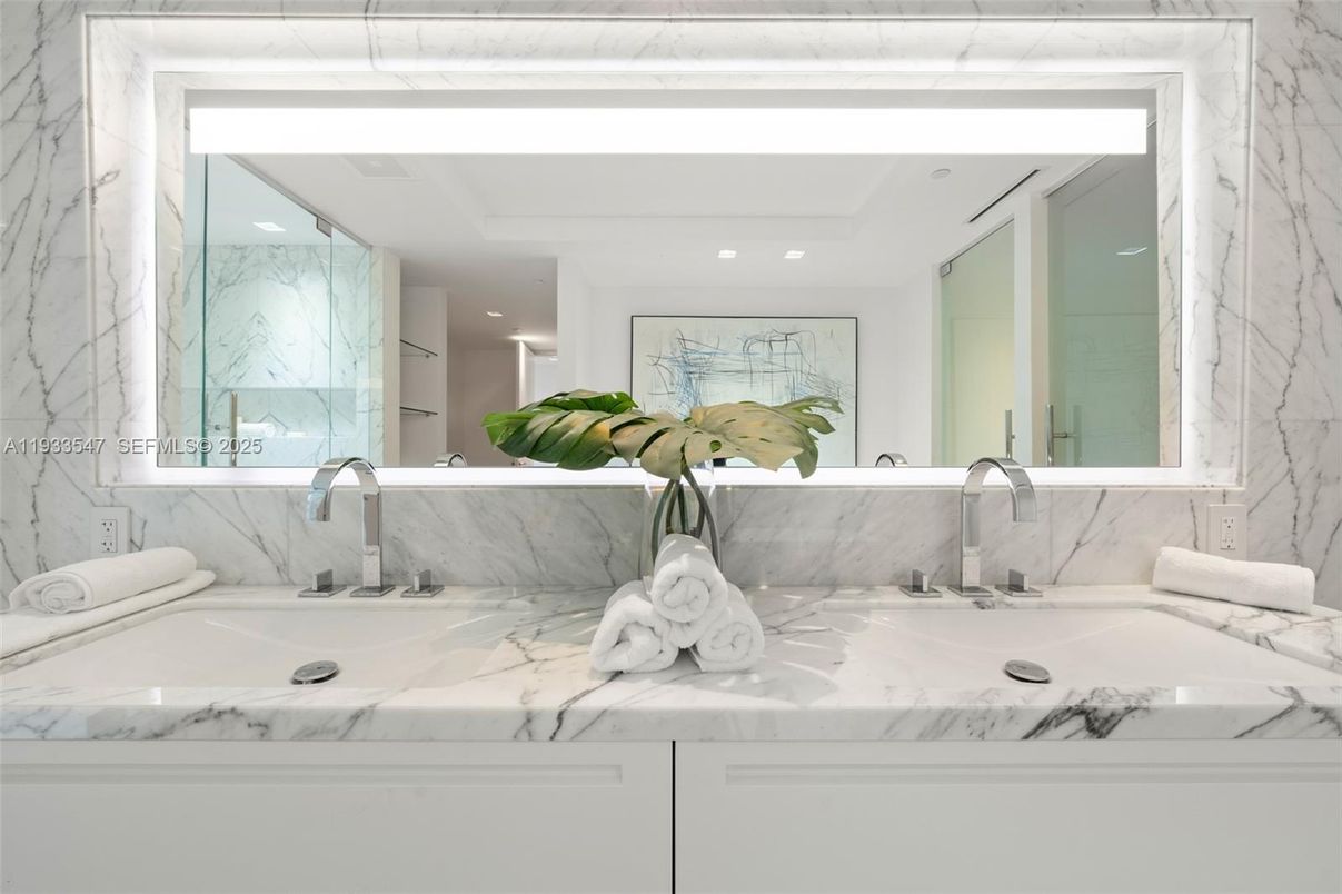 Bathroom, Dual Sink Vanities, Free Standing Baths, Glass Shower, Interior, Marble Walls, Recessed Lighting, Wood Texture Flooring