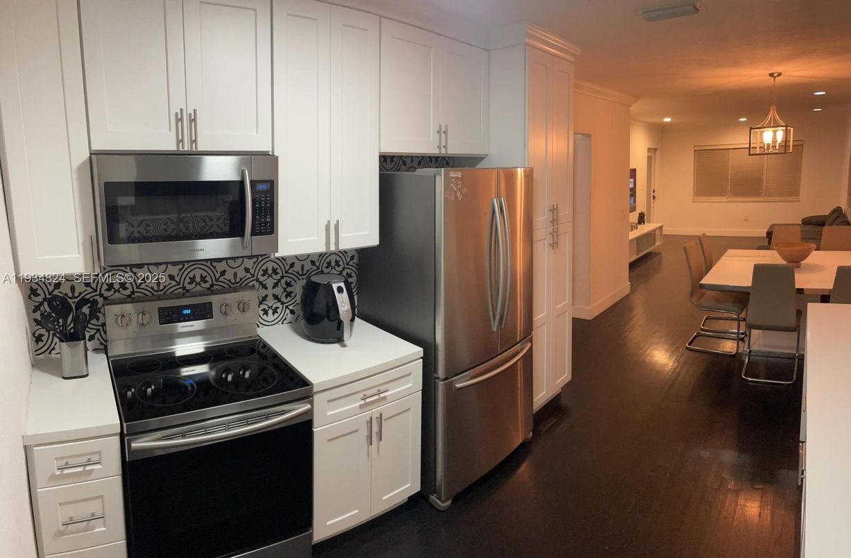 Dining room, Interior, Kitchen, Pendant Lights, Recessed Lighting, Stainless Steel Appliances, Wood Texture Flooring