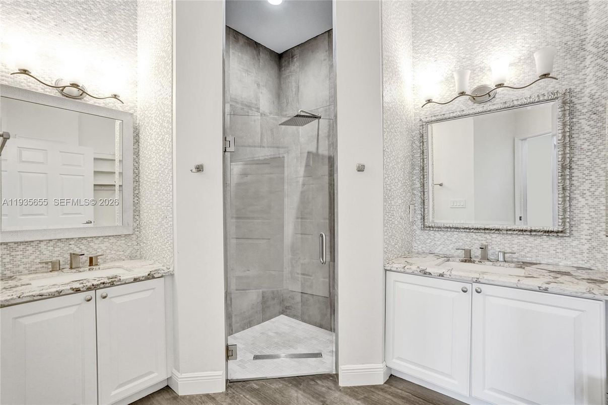 Bathroom, Dual Sink Vanities, Glass Shower, Interior, Recessed Lighting, Wood Texture Flooring