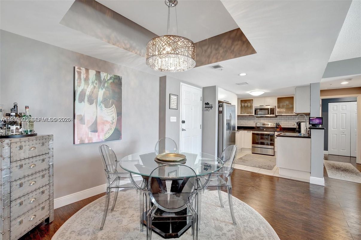 Chandelier, Dining room, Interior, Kitchen, Pendant Lights, Recessed Lighting, Stainless Steel Appliances, Wood Texture Flooring