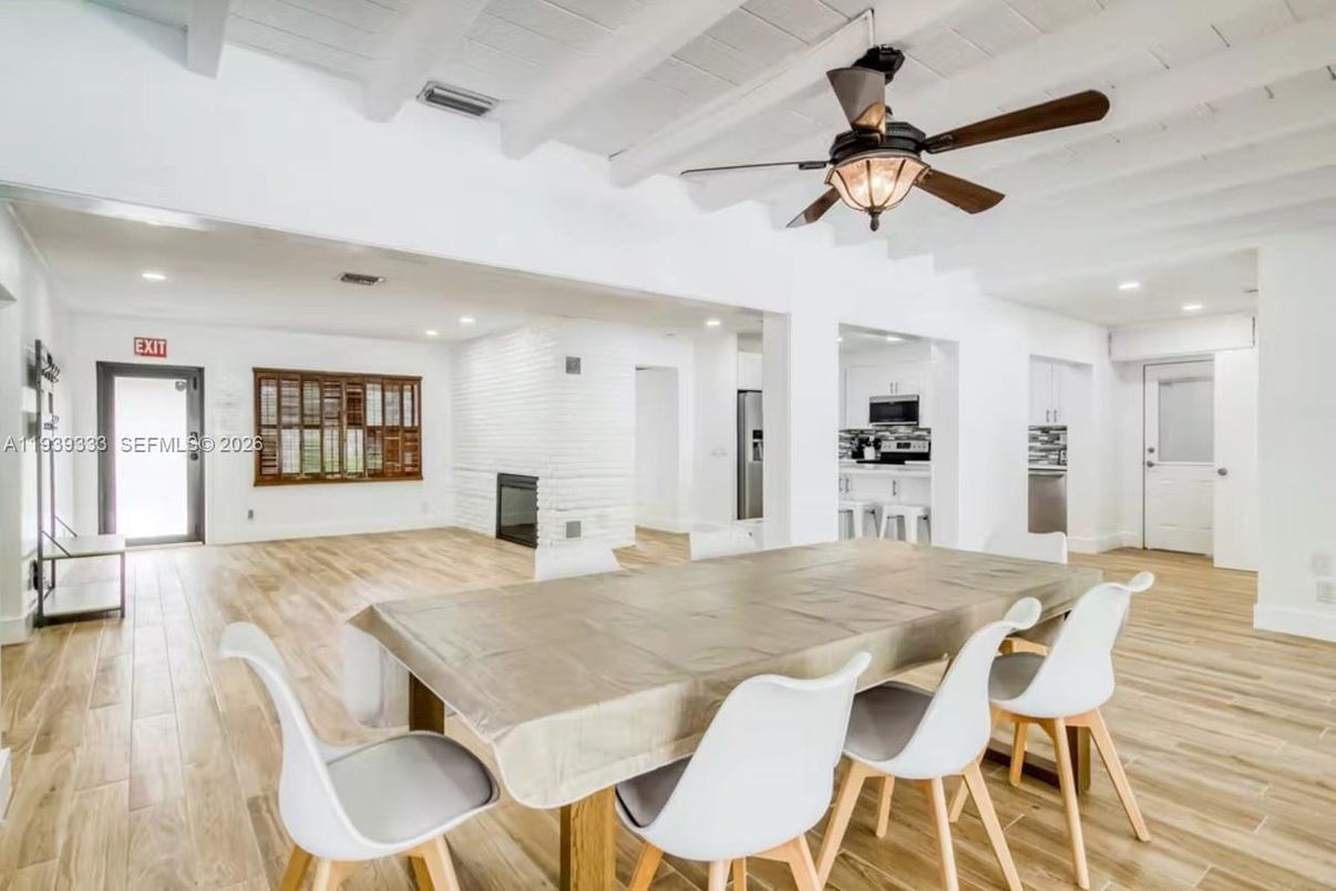 Dining room, Fireplace, Interior, Kitchen, Recessed Lighting, Stone Walls, Wood Texture Flooring