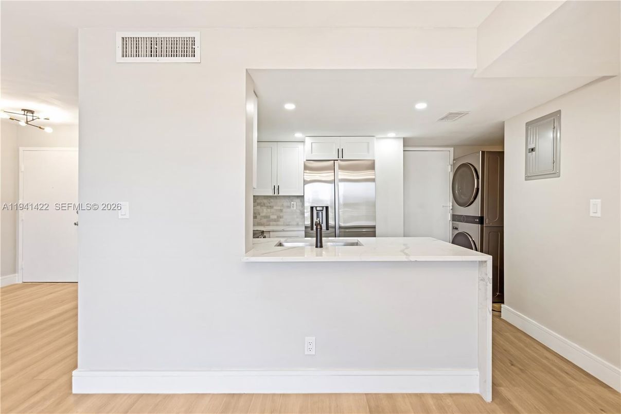Interior, Kitchen, Recessed Lighting, Stainless Steel Appliances, Washer, Wood Texture Flooring