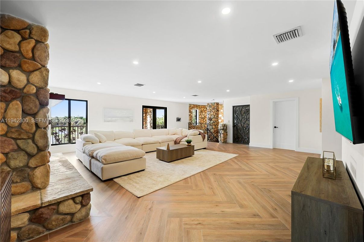 Fireplace, Interior, Living room, Recessed Lighting, Stone Walls, Wood Texture Flooring