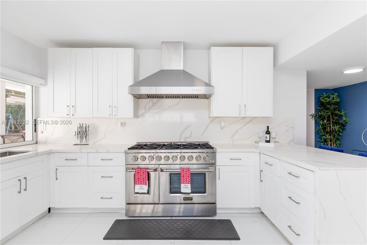 Interior, Kitchen, Marble Walls, Recessed Lighting, Stainless Steel Appliances