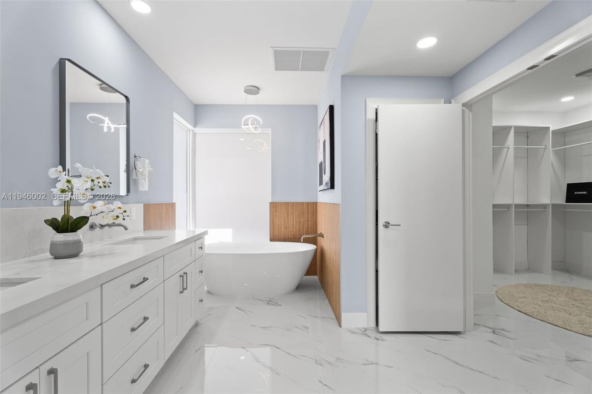 Bathroom, Dual Sink Vanities, Free Standing Baths, Interior, Marble, Pendant Lights, Recessed Lighting, Walk-in Closets