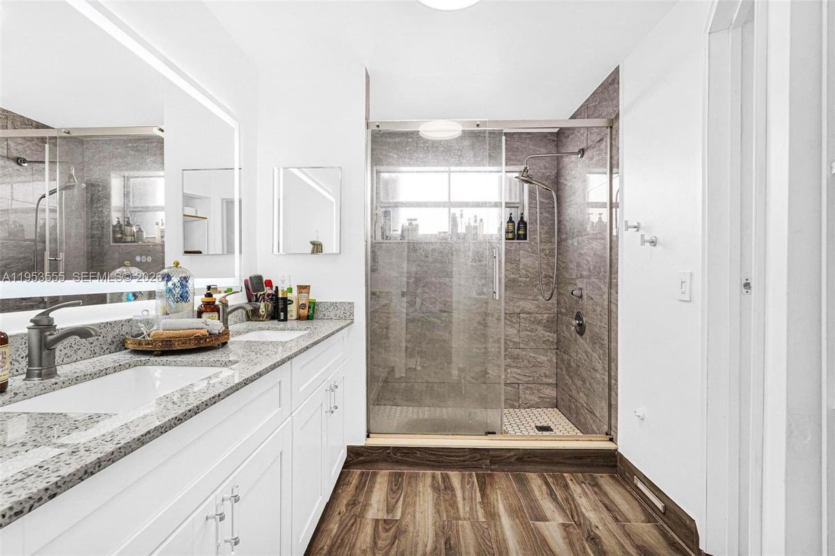 Bathroom, Dual Sink Vanities, Glass Shower, Interior, Wood Texture Flooring