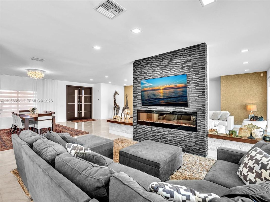 Chandelier, Dining room, Fireplace, Interior, Living room, Recessed Lighting, Stone Walls