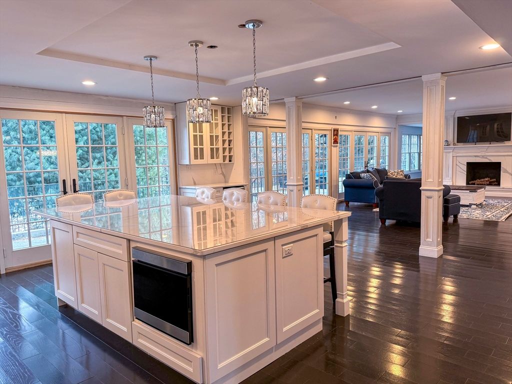 Chandelier, Fireplace, Interior, Kitchen, Living room, Pendant Lights, Recessed Lighting, Wood Texture Flooring