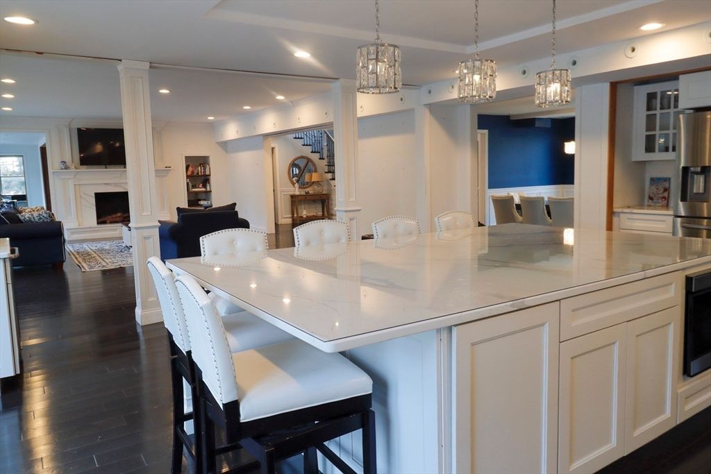 Chandelier, Dining room, Fireplace, Interior, Kitchen, Living room, Pendant Lights, Recessed Lighting, Wood Texture Flooring