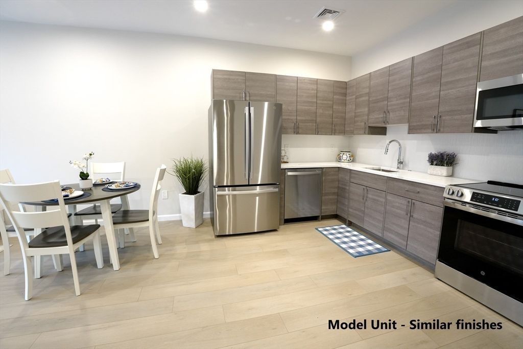 Dining room, Interior, Kitchen, Recessed Lighting, Stainless Steel Appliances, Wood Texture Flooring