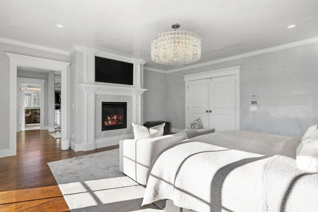 Bedroom, Chandelier, Fireplace, Interior, Recessed Lighting, Wood Texture Flooring