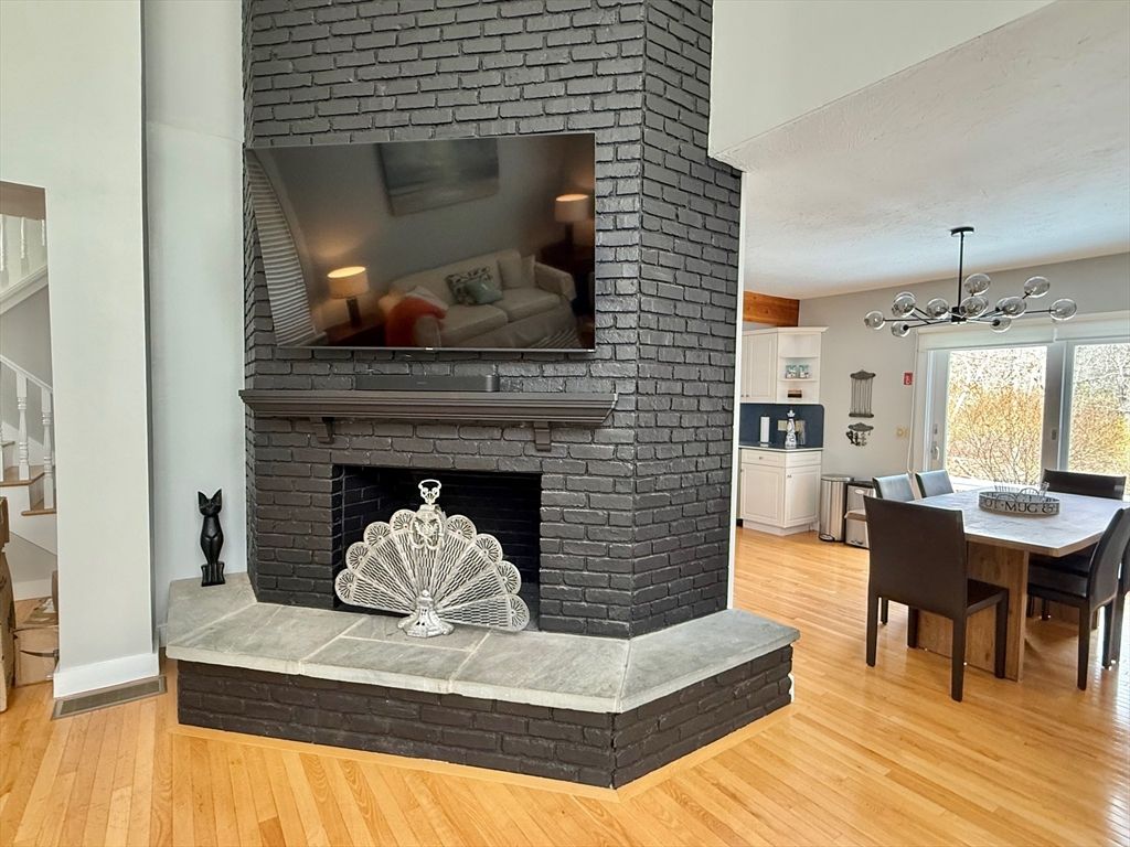 Dining room, Fireplace, Interior, Pendant Lights, Stone Walls, Wood Texture Flooring
