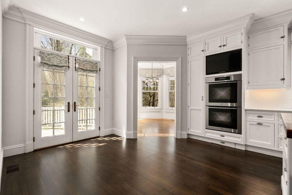 Empty room, Interior, Kitchen, Recessed Lighting, Stainless Steel Appliances, Wood Texture Flooring