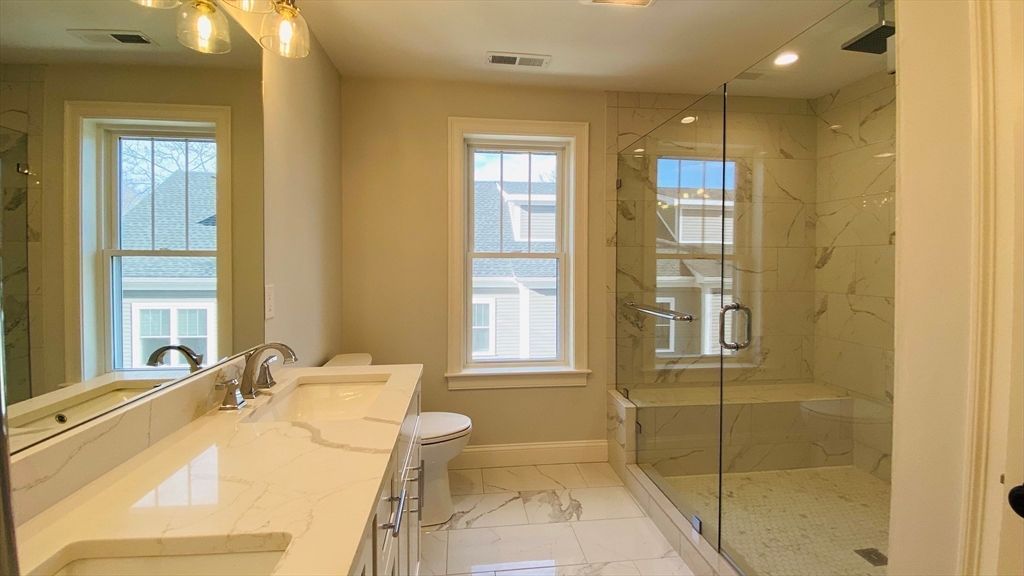 Bathroom, Dual Sink Vanities, Glass Shower, Interior, Marble, Marble Walls, Recessed Lighting