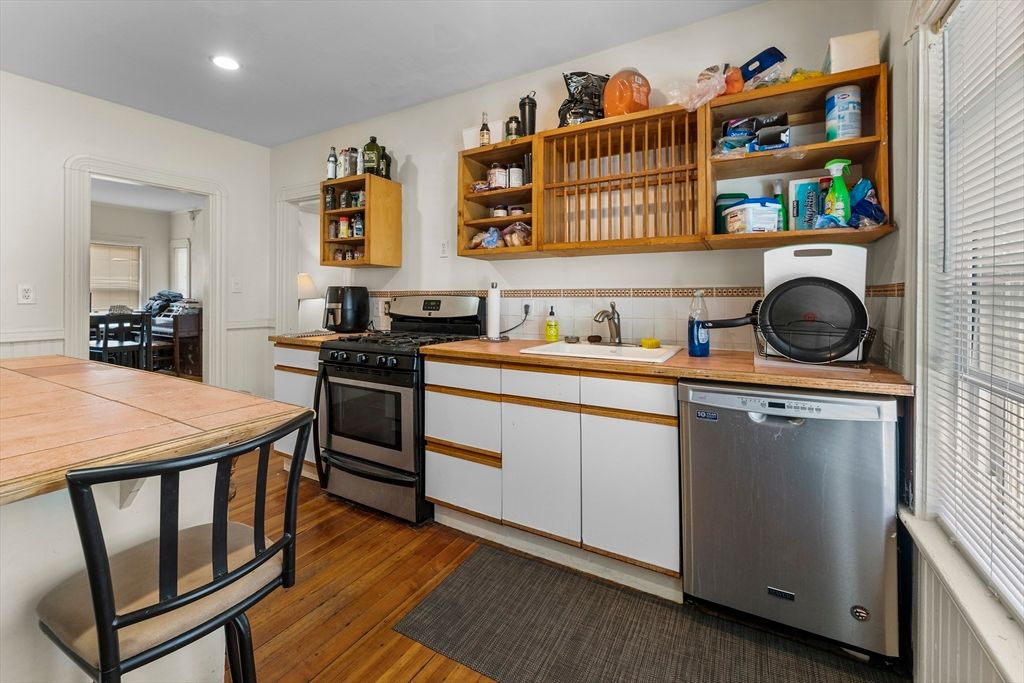 Interior, Kitchen, Recessed Lighting, Stainless Steel Appliances, Tile Countertops, Wood Texture Flooring