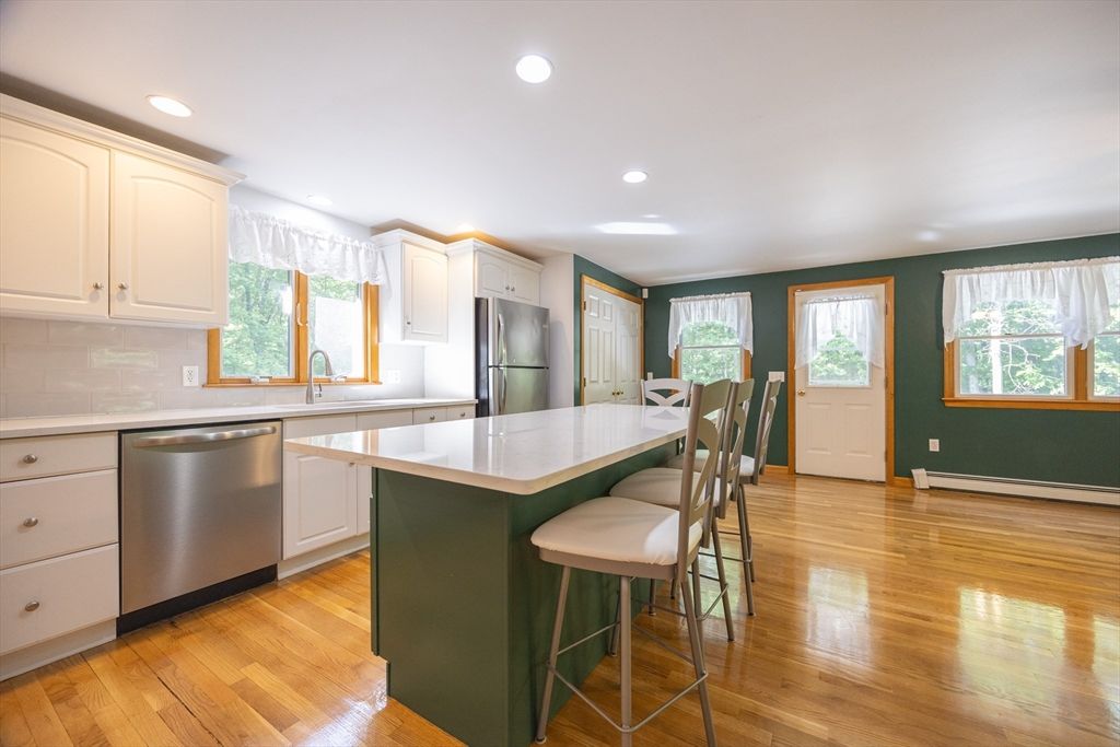 Dining room, Interior, Kitchen, Recessed Lighting, Stainless Steel Appliances, Wood Texture Flooring