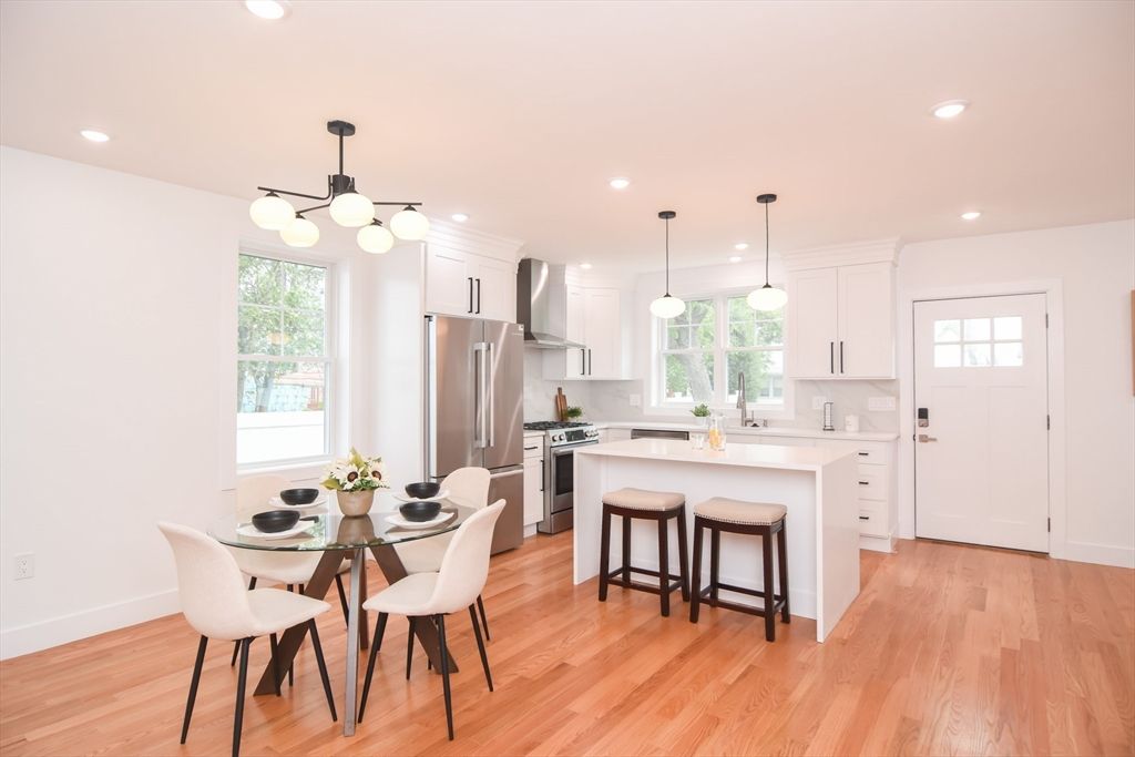 Dining room, Interior, Kitchen, Pendant Lights, Recessed Lighting, Stainless Steel Appliances, Wood Texture Flooring