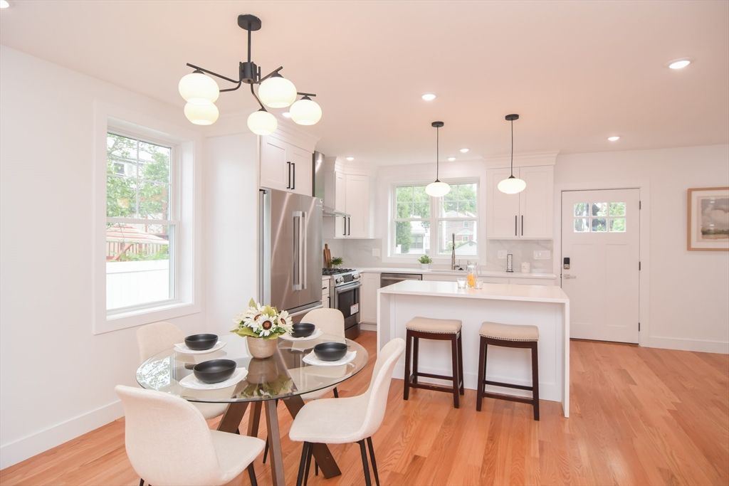 Dining room, Interior, Kitchen, Pendant Lights, Recessed Lighting, Stainless Steel Appliances, Wood Texture Flooring