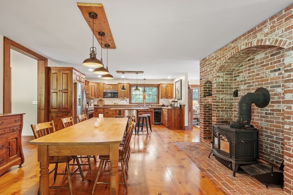 Dining room, Interior, Kitchen, Pendant Lights, Stainless Steel Appliances, Stone Walls, Wood Texture Flooring