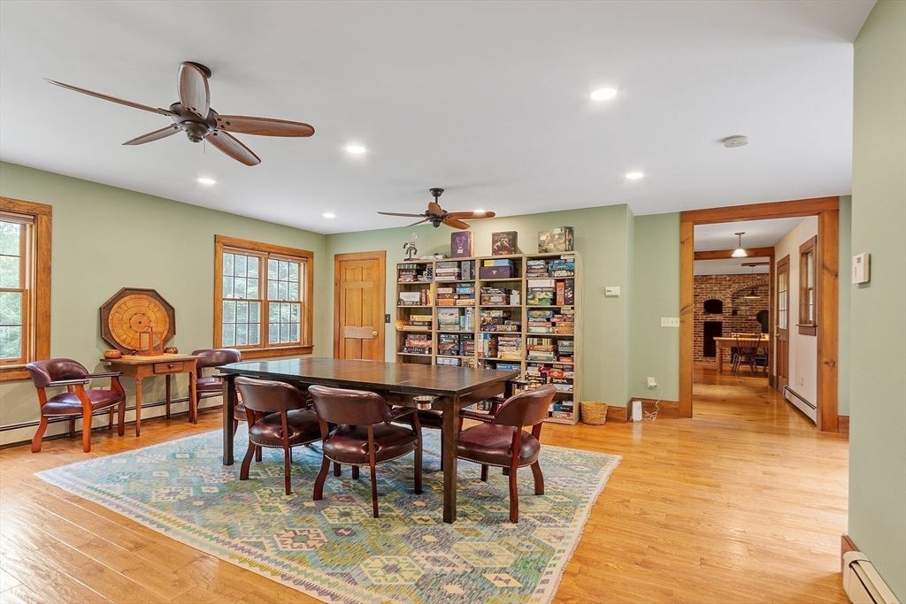 Dining room, Fireplace, Interior, Recessed Lighting, Stone Walls, Wood Texture Flooring