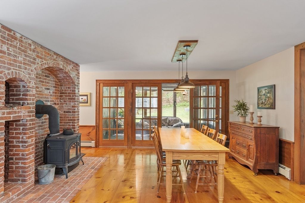 Dining room, Fireplace, Interior, Pendant Lights, Stone Walls, Wood Texture Flooring