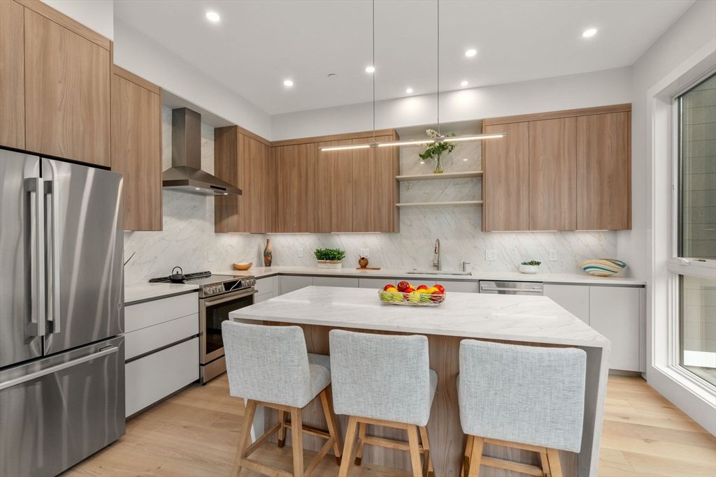 Interior, Kitchen, Marble Walls, Pendant Lights, Recessed Lighting, Stainless Steel Appliances, Wood Texture Flooring