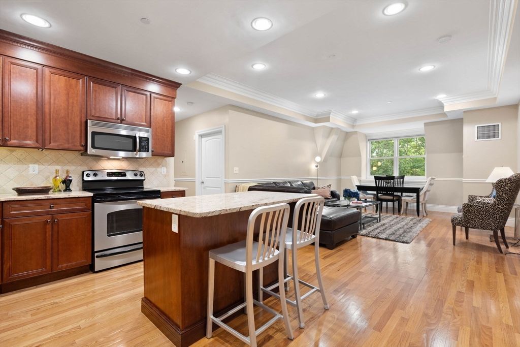 Dining room, Interior, Kitchen, Living room, Recessed Lighting, Stainless Steel Appliances, Wood Texture Flooring