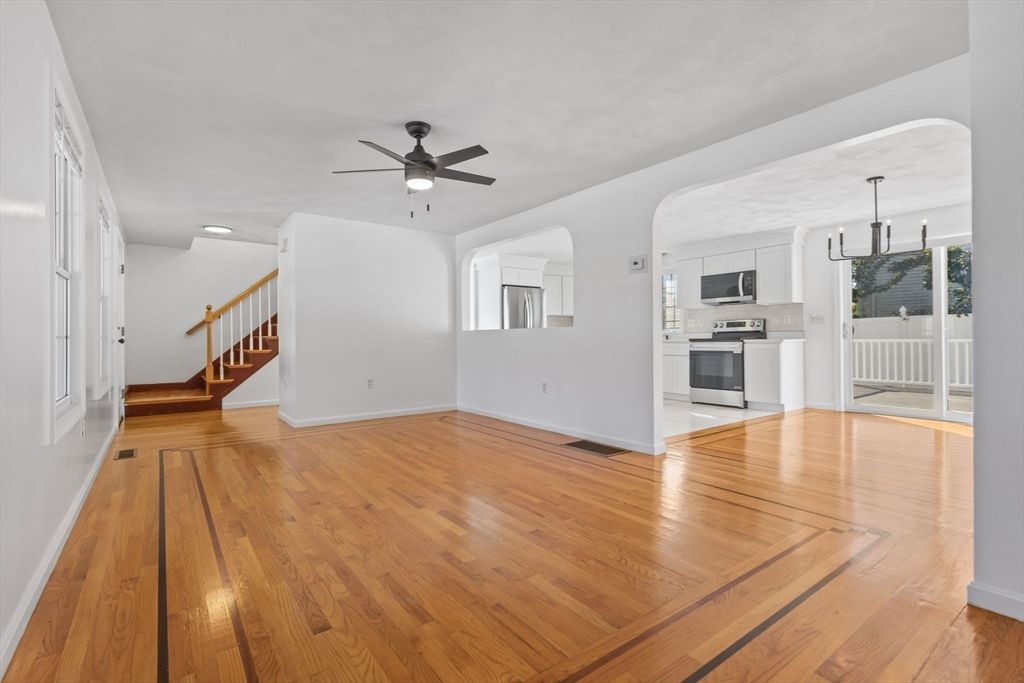 Empty room, Interior, Kitchen, Pendant Lights, Recessed Lighting, Stainless Steel Appliances, Wood Texture Flooring