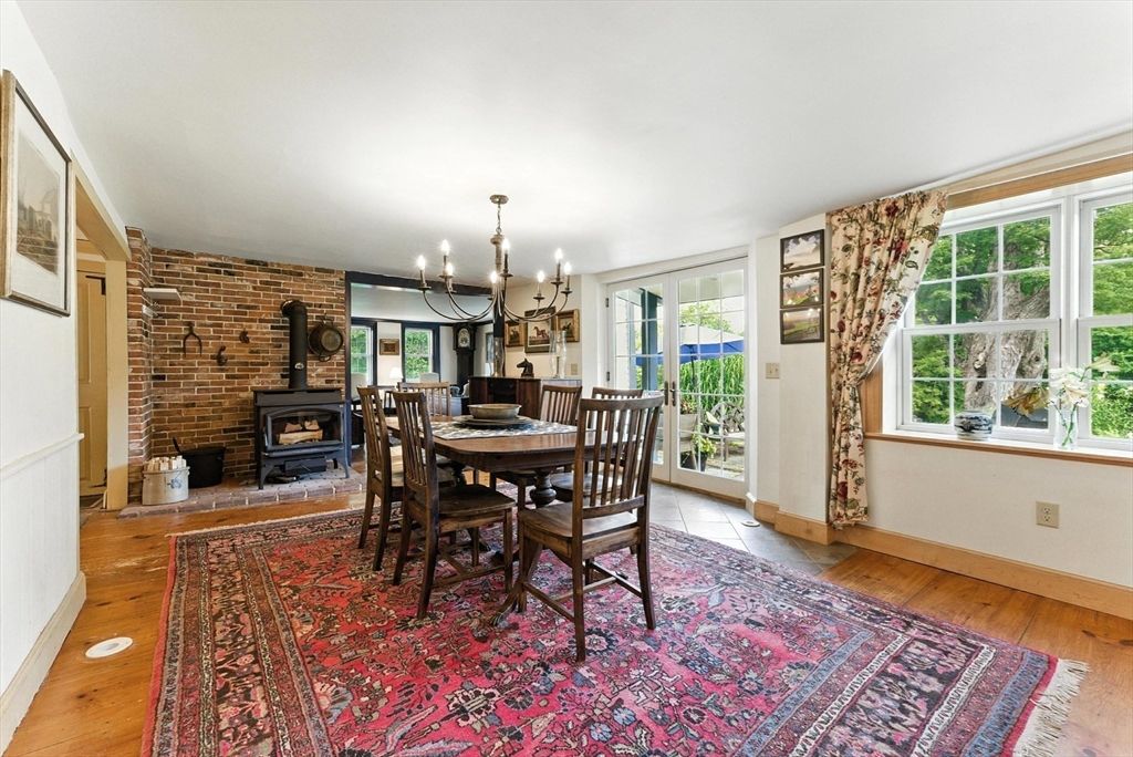 Chandelier, Dining room, Fireplace, Interior, Stone Walls, Wood Texture Flooring
