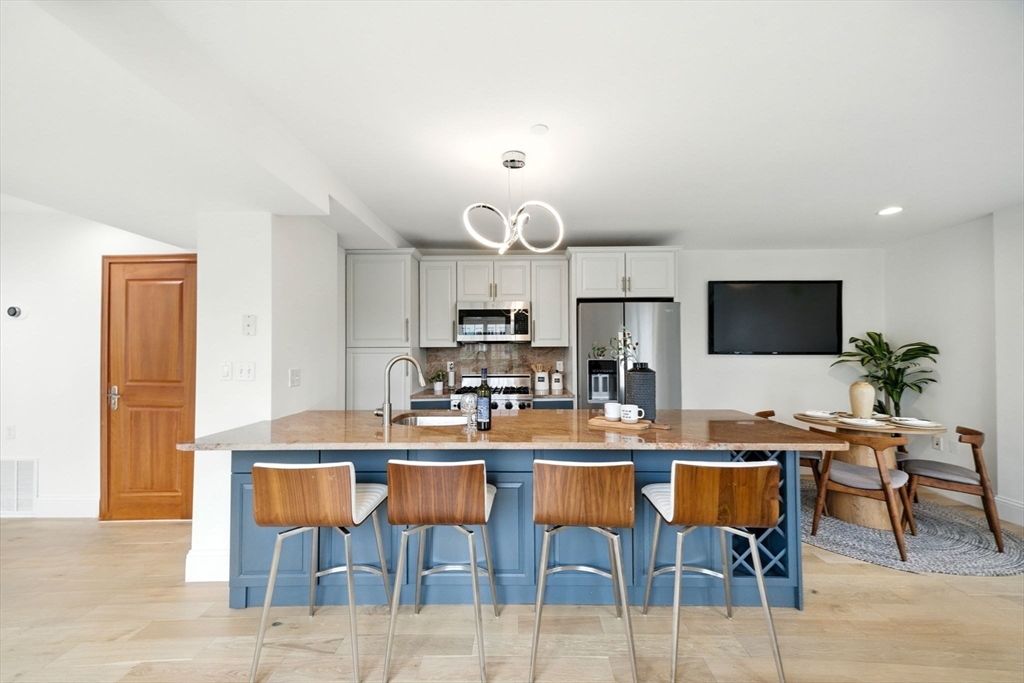 Dining room, Interior, Kitchen, Pendant Lights, Recessed Lighting, Stainless Steel Appliances, Wood Texture Flooring