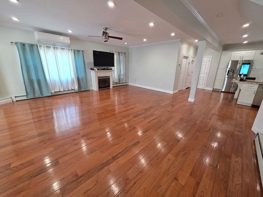 Empty room, Fireplace, Interior, Kitchen, Recessed Lighting, Wood Texture Flooring