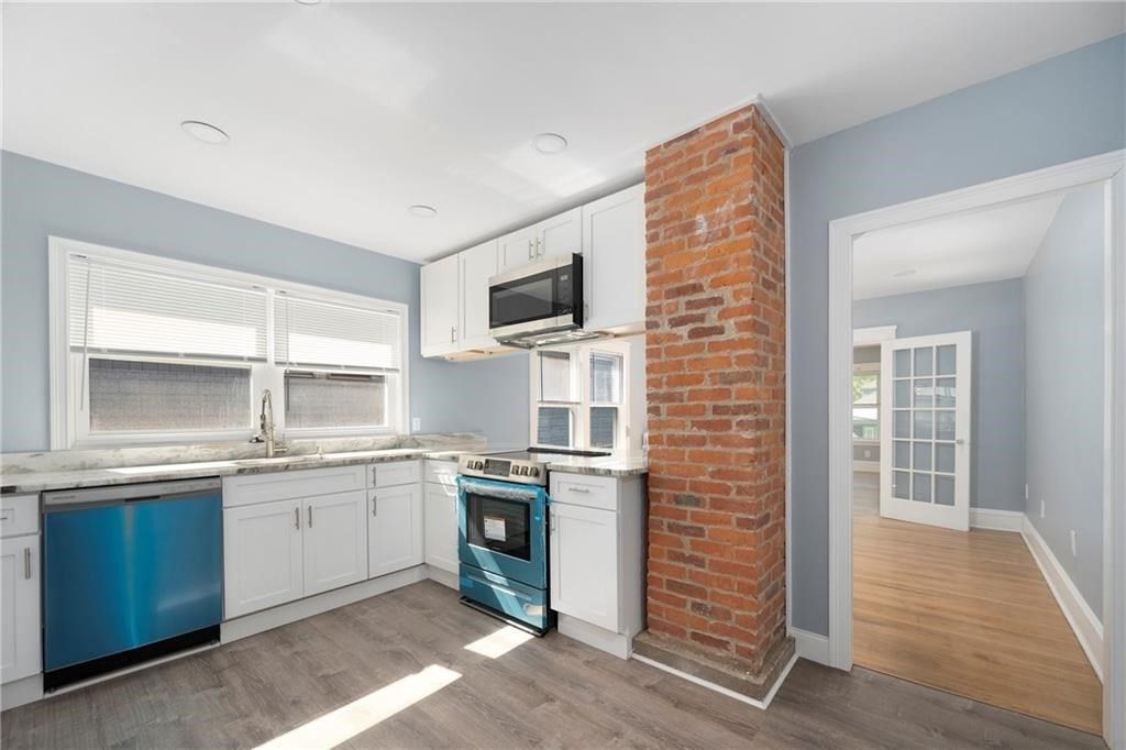 Interior, Kitchen, Recessed Lighting, Stainless Steel Appliances, Stone Walls, Wood Texture Flooring