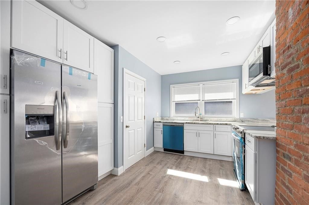 Interior, Kitchen, Recessed Lighting, Stainless Steel Appliances, Stone Walls, Wood Texture Flooring