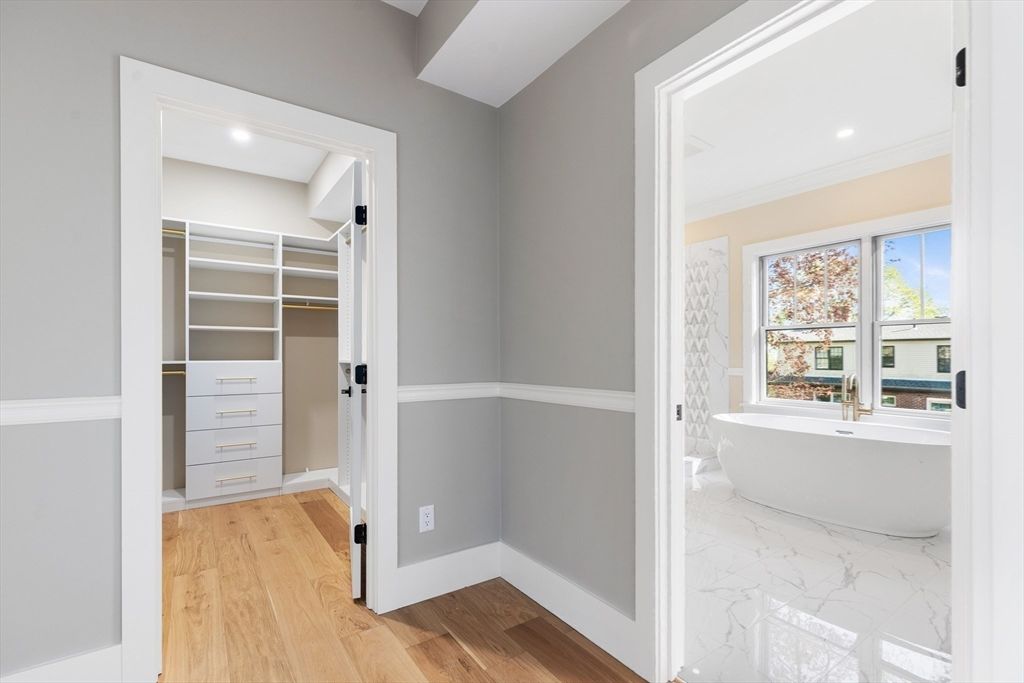 Bathroom, Free Standing Baths, Interior, Marble, Recessed Lighting, Walk-in Closets, Wood Texture Flooring