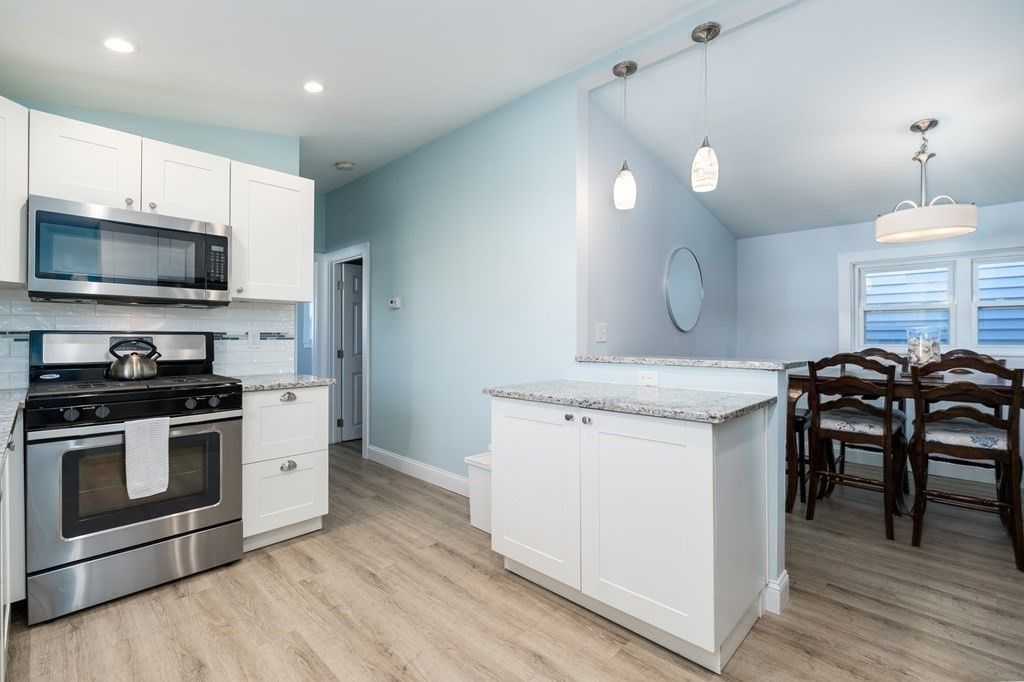 Dining room, Interior, Kitchen, Pendant Lights, Recessed Lighting, Stainless Steel Appliances, Wood Texture Flooring