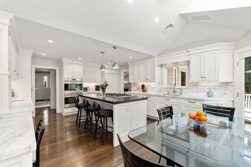 Interior, Kitchen, Marble Walls, Pendant Lights, Recessed Lighting, Stainless Steel Appliances, Wood Texture Flooring