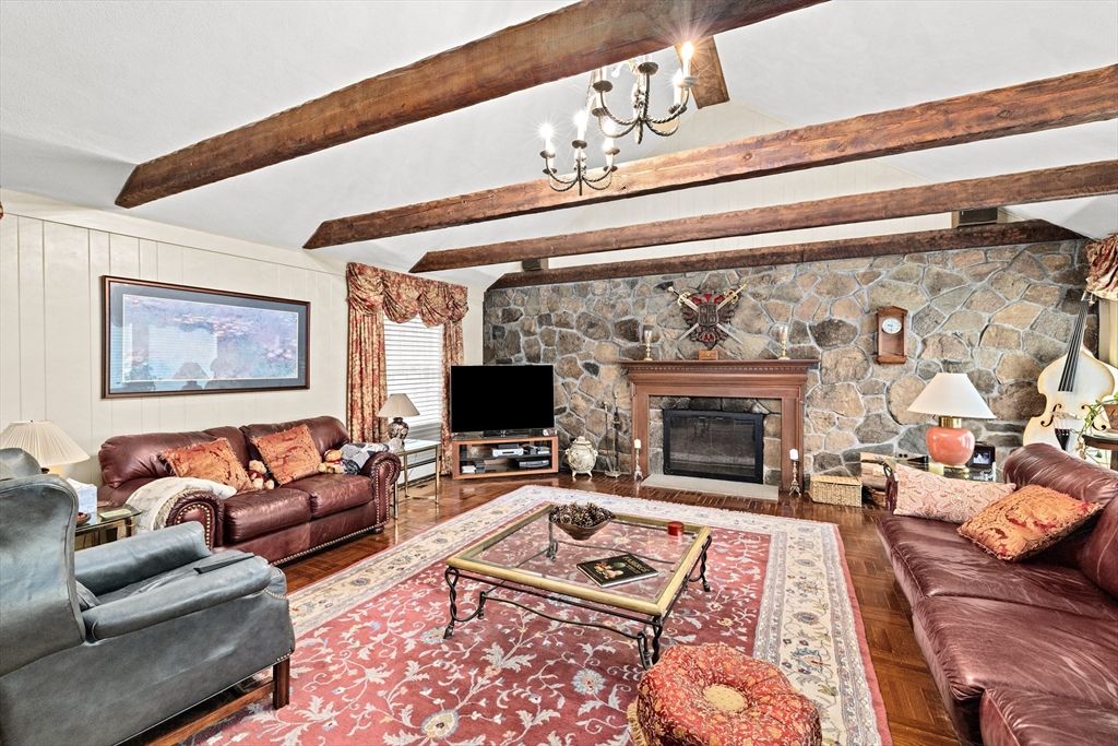 Chandelier, Fireplace, Interior, Living room, Stone Walls, Wooden Beams, Wood Texture Flooring