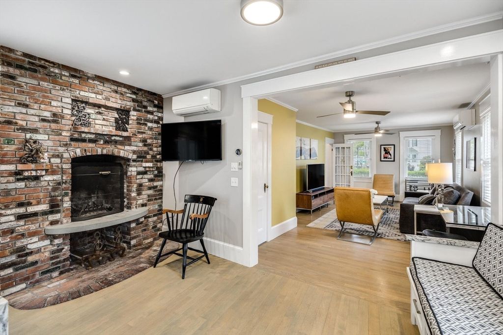 Dining room, Fireplace, Interior, Living room, Recessed Lighting, Stone Walls, Wood Texture Flooring