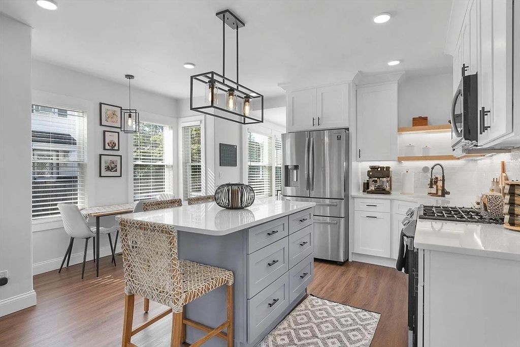 Dining room, Interior, Kitchen, Pendant Lights, Recessed Lighting, Stainless Steel Appliances, Wood Texture Flooring