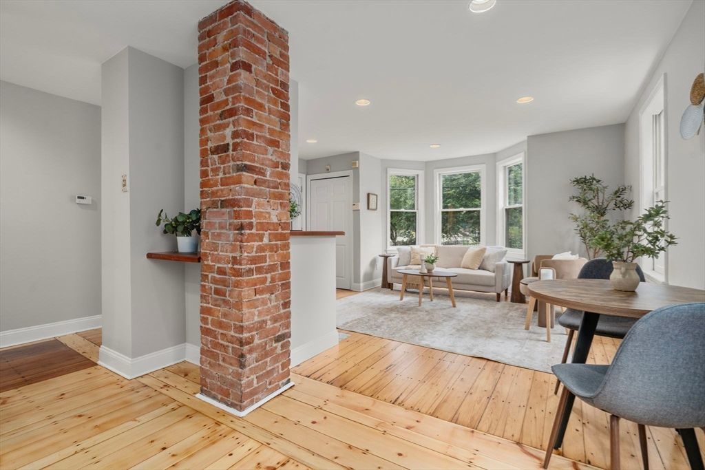 Dining room, Fireplace, Interior, Living room, Recessed Lighting, Stone Walls, Wood Texture Flooring