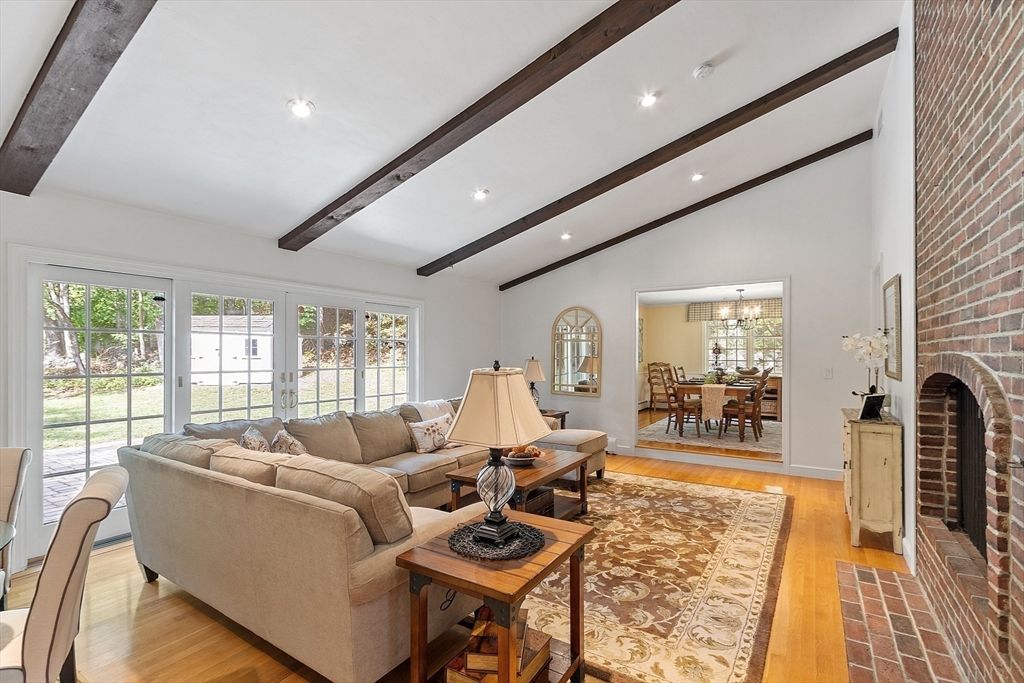 Chandelier, Dining room, Fireplace, Interior, Living room, Recessed Lighting, Stone Walls, Wooden Beams, Wood Texture Flooring