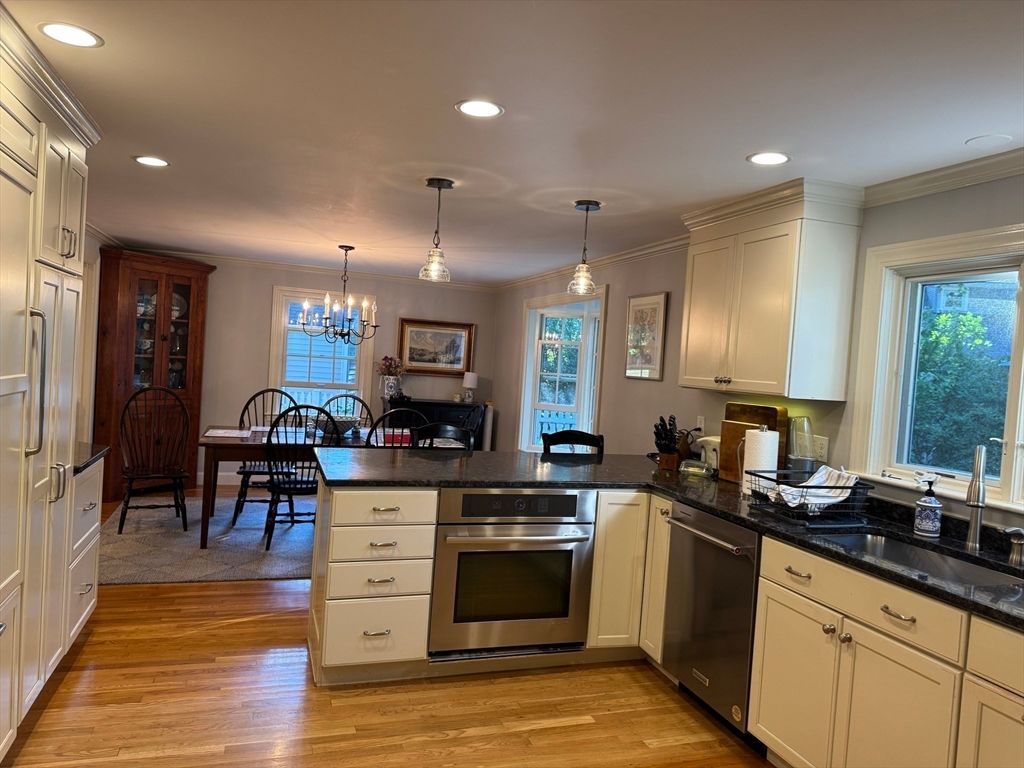 Chandelier, Dining room, Interior, Kitchen, Pendant Lights, Recessed Lighting, Stainless Steel Appliances, Wood Texture Flooring