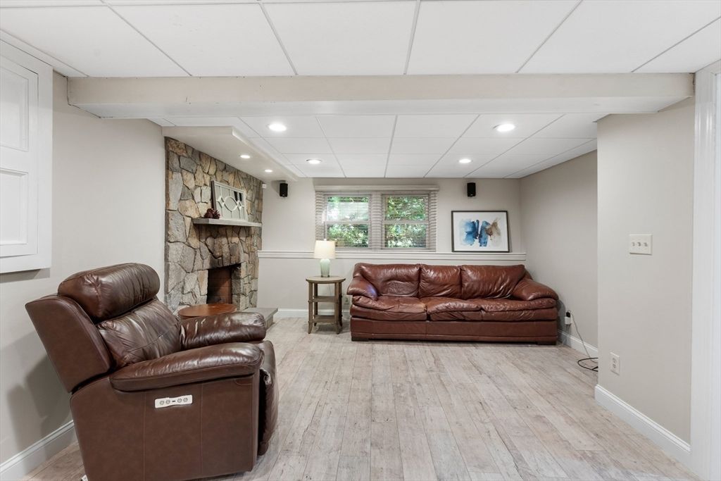 Fireplace, Interior, Living room, Recessed Lighting, Stone Walls, Wood Texture Flooring